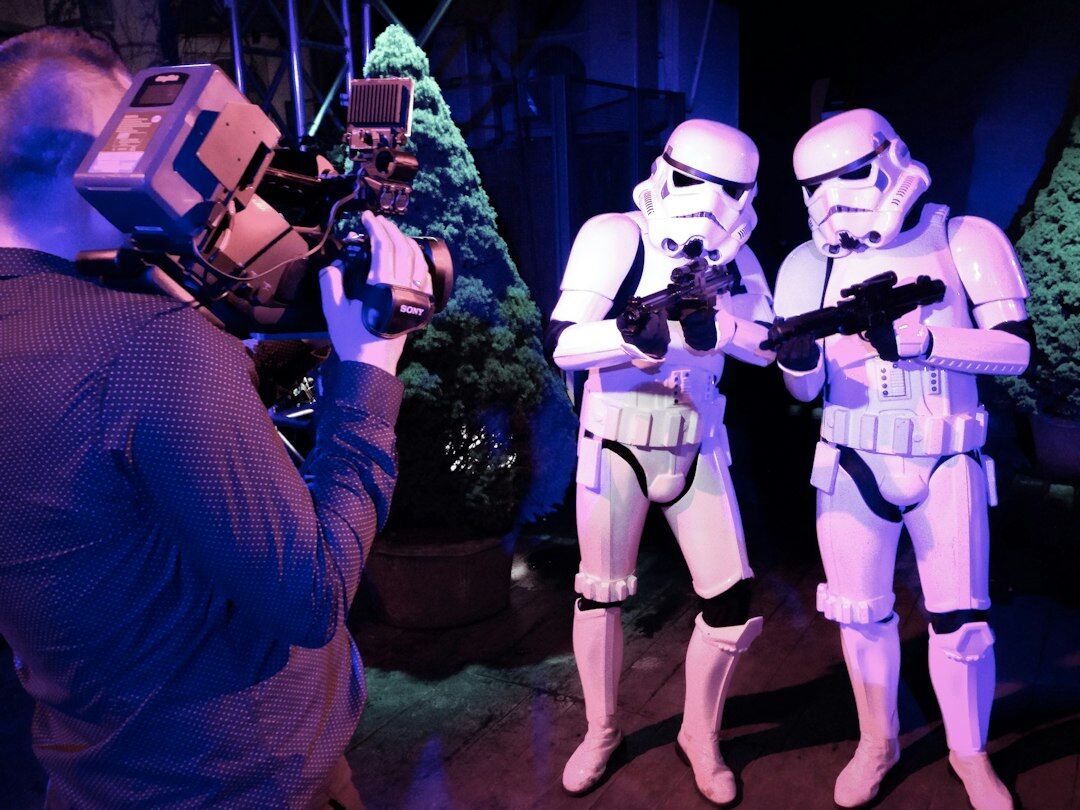 Photographer and camera crew covering a celebrity event